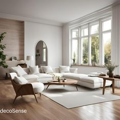 a living room with white furniture and wood flooring is shown in front of large windows