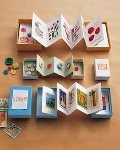 an open book sitting on top of a table next to some buttons and magnets