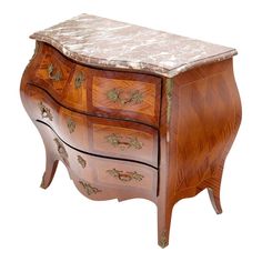 an ornate wooden chest with marble top