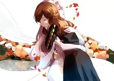 two people are hugging each other in front of an artistic background with flowers and leaves