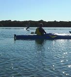 two people are in a canoe on the water