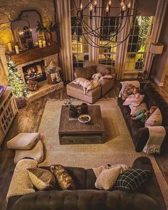 a living room filled with furniture and a fire place