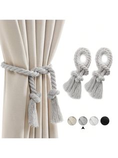 curtains with tassels hanging from them and some buttons on the curtain roding