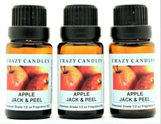 three bottles of crazy candles apple jack and peel essential oil sitting side by side on a white background