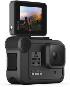 an action camera with the image of a man and woman on it's screen