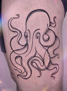 an octopus tattoo on the thigh