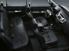 the interior of a car with black leather seats