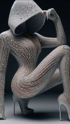 a woman in high heels and silver bodysuit with sequins on her legs