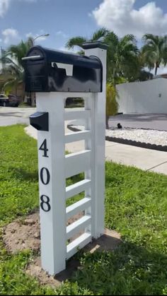 there is a mailbox with a ladder on it