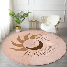 a living room with a chair and rug on the floor next to a potted plant