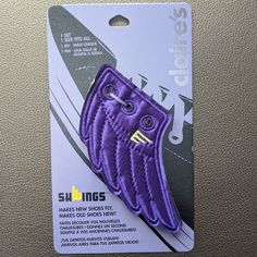 the purple shoe clip is in its package