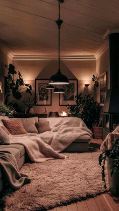 a living room filled with lots of furniture and plants