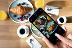 a person taking a photo of food on their phone