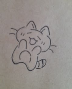 a small drawing of a cat on the back of a woman's stomach,