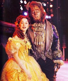 a man and woman dressed up as beauty and the beast