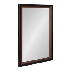 a mirror that is on the wall with a brown frame and dark wood trimming