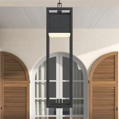 an open window with shutters and a lamp hanging from it's side in front of two arched windows