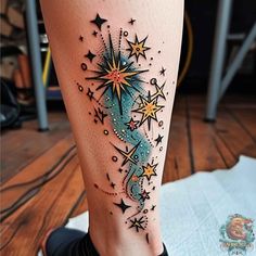 a woman's leg with stars and planets on the bottom part of her legs