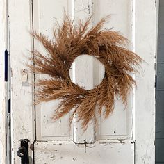 a door with a wreath hanging on it