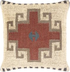 a red cross pillow with blue accents on the front and back, sitting on a white background