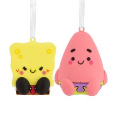 two different shaped items hanging from strings on a white background, one is pink and the other is yellow