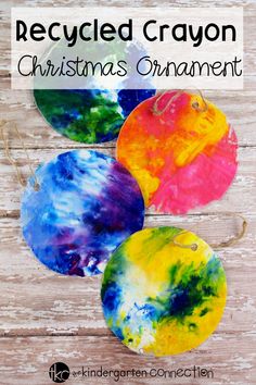 three homemade christmas ornaments made with melted paint on wooden planks, and the words recycled crayon christmas ornament