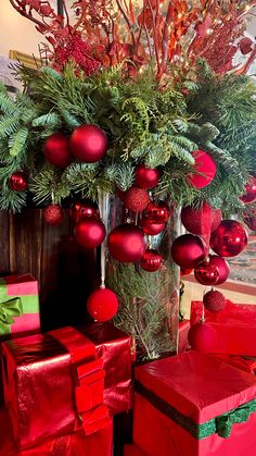 red and green christmas decorations in a vase