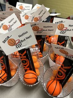 small plastic cups filled with orange basketballs