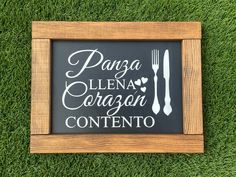 a sign that reads panza llena cora conteno on the grass