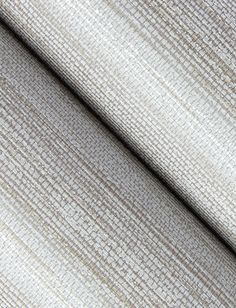 an upholstered fabric textured with white and beige colors, as seen from the side