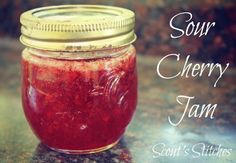 a jar filled with red liquid sitting on top of a counter