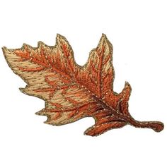 an image of a leaf that is brown and gold in color on a white background