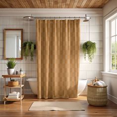 a bath room with a toilet and a shower curtain