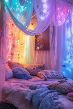 a canopy bed covered in lights and pillows