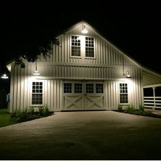 a white barn lit up at night with the words best 25 metal barn ideas on pinterest