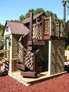 an outdoor play structure made out of wood