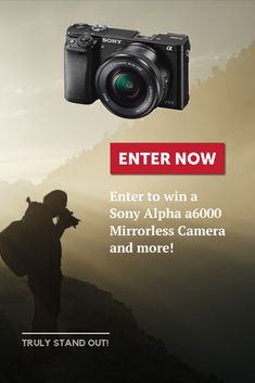 a man holding a camera with the words enter now