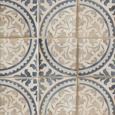 an old tile pattern with blue and white designs on the tiles in different shapes, sizes and colors