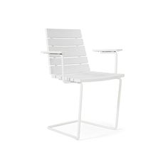 a white chair sitting on top of a metal frame