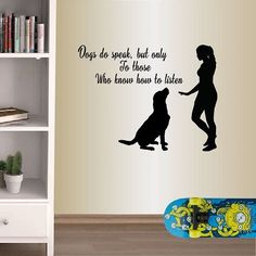 there is a wall decal with a dog and a person on the skateboard