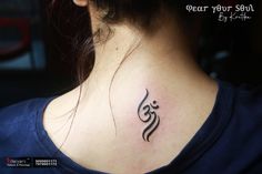 a woman with a tattoo on her neck