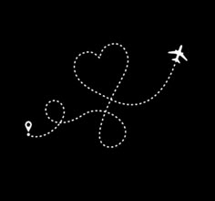 an airplane is flying in the sky with a heart on it's tail,