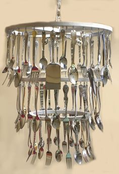 a chandelier with forks and spoons hanging from it