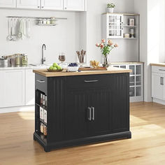 a kitchen island in the middle of a wooden floor