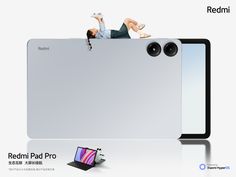 an advertisement for the new redmi pad pro with a man laying on top of it