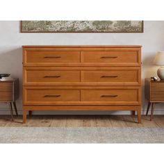 a large wooden dresser sitting next to a lamp