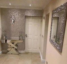 a bathroom with two sinks and mirrors on the wall next to it's tiled floor