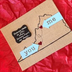 a piece of fabric with some words on it and two magnets in the shape of a map