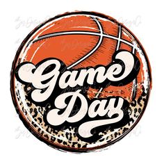 a basketball with the words game day written on it in leopard print, and an orange ball