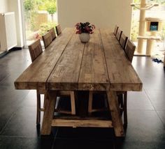 a large wooden table with chairs around it